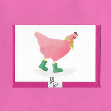 Load image into Gallery viewer, A stylised watercolour illustration of a pink chicken, wearing a yellow scarf with green flowers around its neck, and green wellies on its feet, on a greeting card. With a bright pink envelope held together by an eco friendly plastic free card catch sticker, on a pink background.
