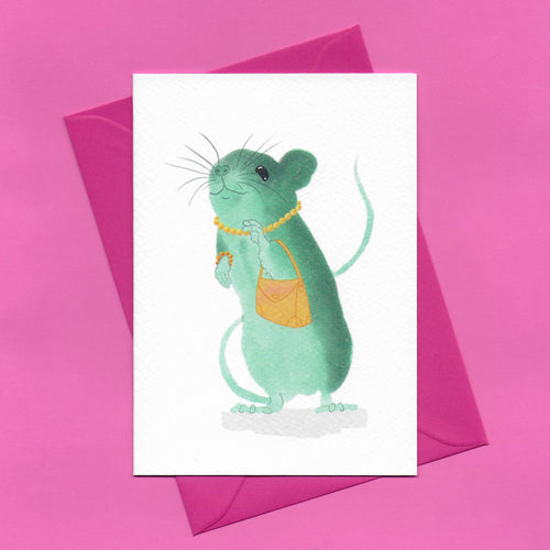 A stylised watercolour illustration on a greeting card of a teal coloured field mouse wearing a yellow beaded necklace and bracelet and holding a yellow handbag, with a bright pink envelope, on a pink background