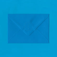 Load image into Gallery viewer, A bright blue envelope with the Elizabeth May Designs logo embossed on the flap, sitting on a blue background
