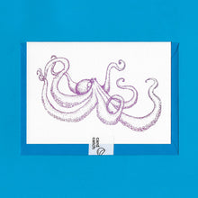 Load image into Gallery viewer, A detailed colour illustration on a luxury greeting card of a purple coloured octopus, with a kingfisher blue envelope held together with an eco friendly plastic free card catch sticker, sitting on a blue background
